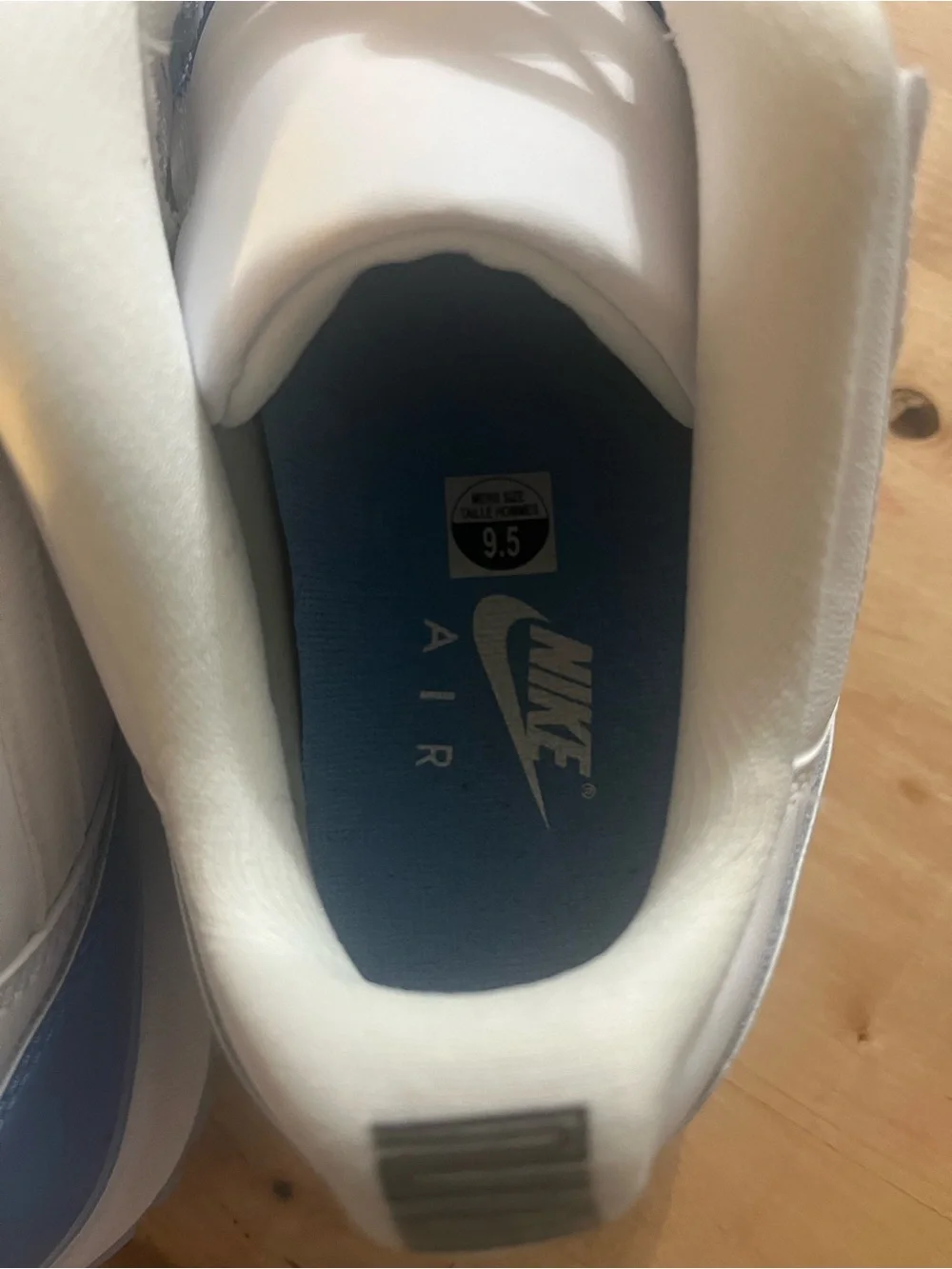 UNC Jordan 11 Low-Top Sneakers in White and Light Blue Patent